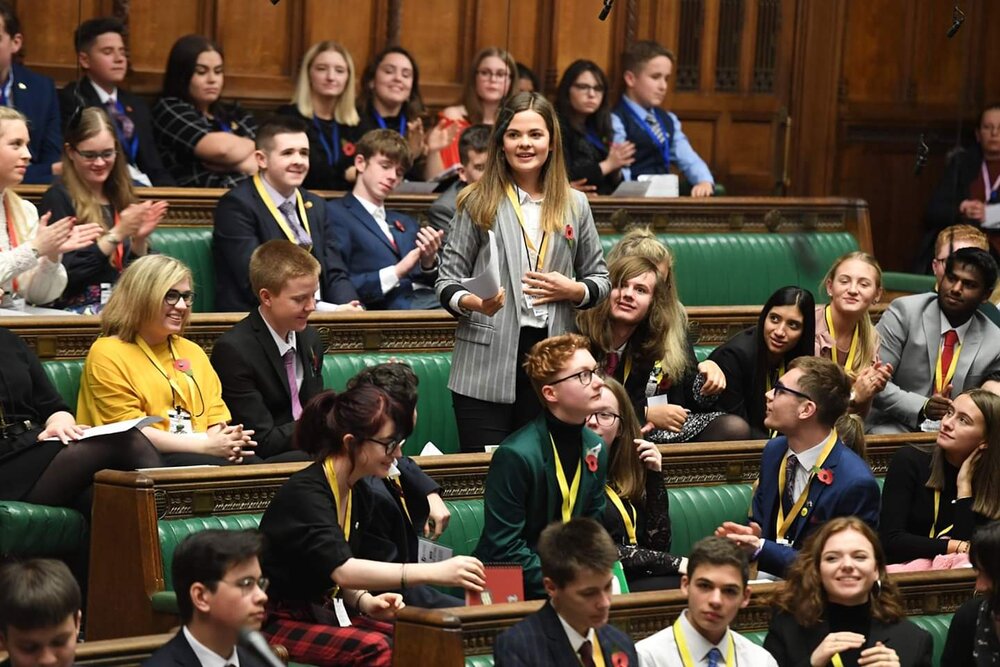 Emma (standing centre) speaking at the House of Commons for UK Youth Parliament. Photo: UK Youth Parliament 