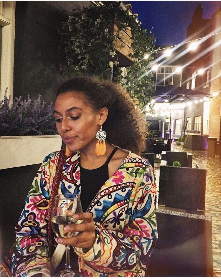 Evie Muir on a night out, enjoying a glass of wine al fresco. Photo: Evie Muir