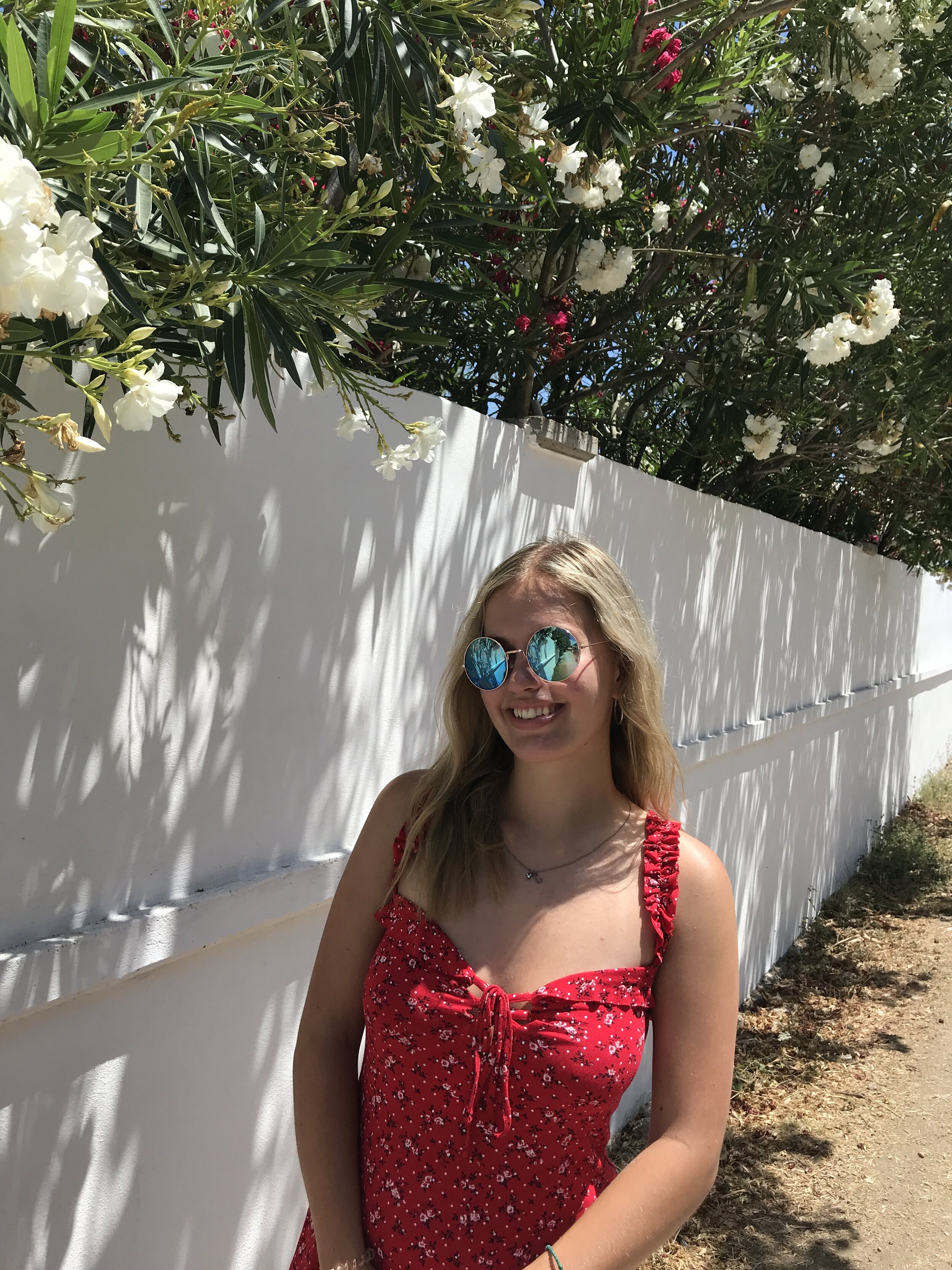 In a strappy red sundress on holiday in Greece, 2019.Photo Claudia Parker.jpeg