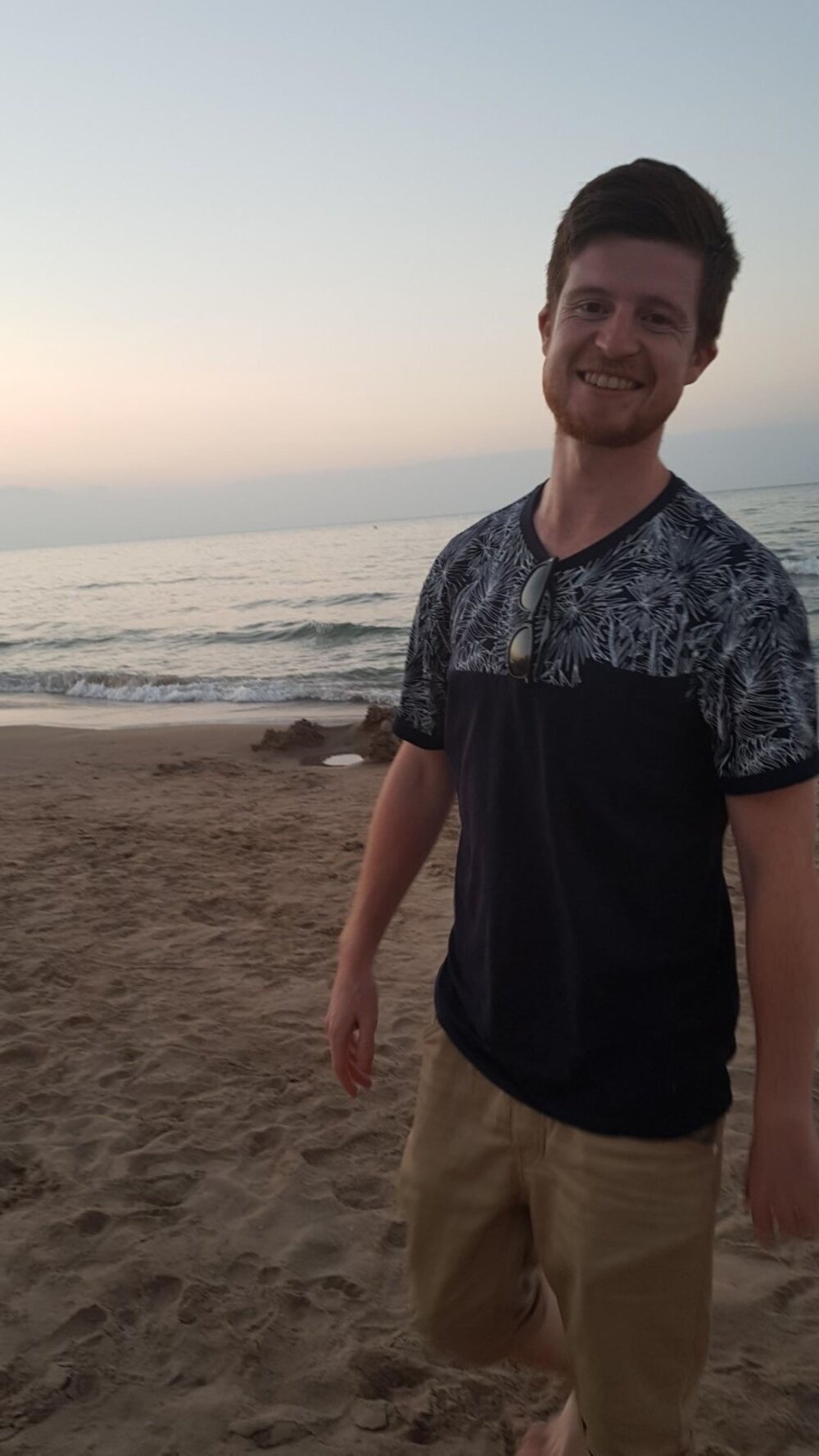 Alex enjoying the sunset on Denia Beach 2018. The sea can be see in the background. Photo: Alex Waite