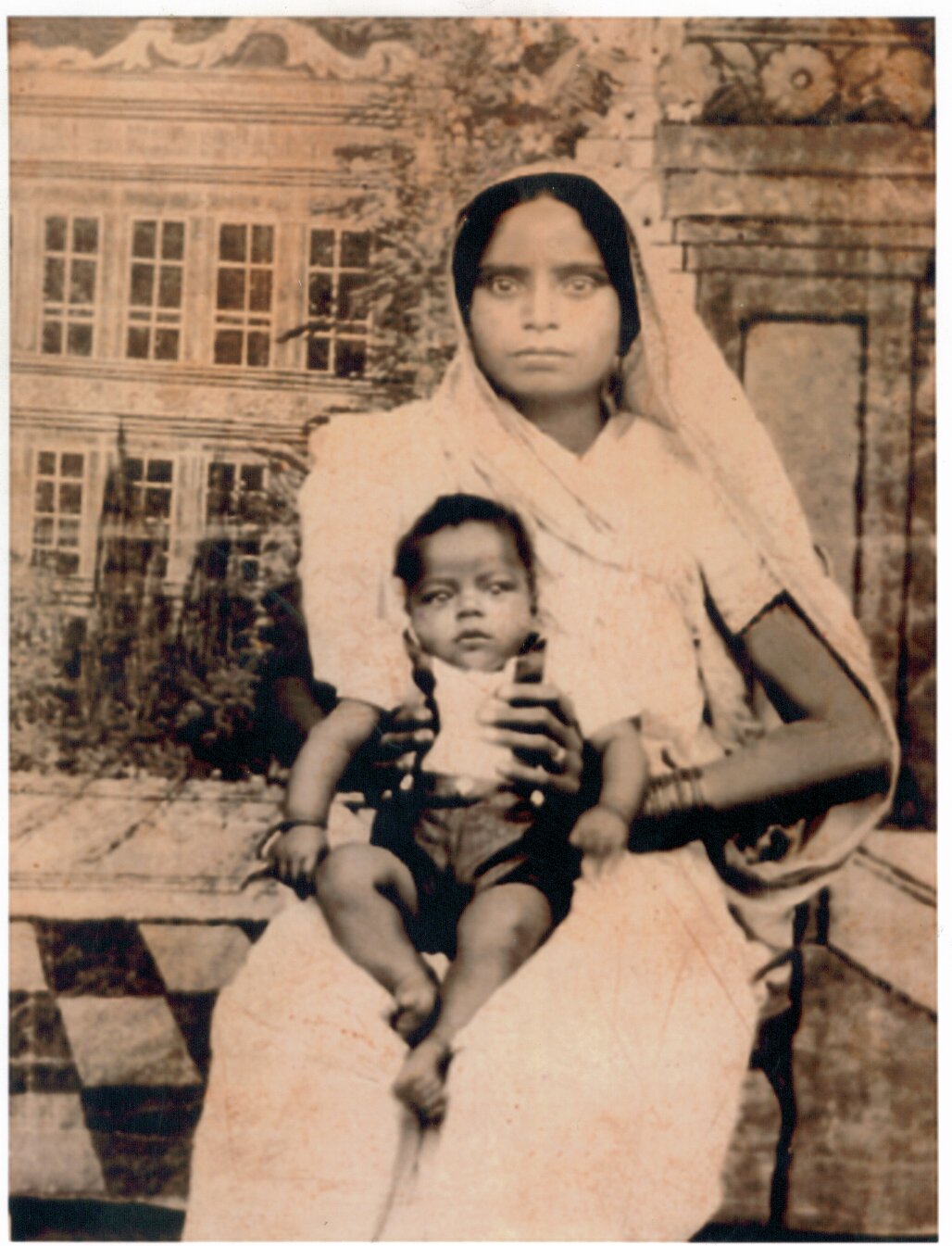 baby Baluji sitting on his mother's lap. Photo: Lacuna Voices