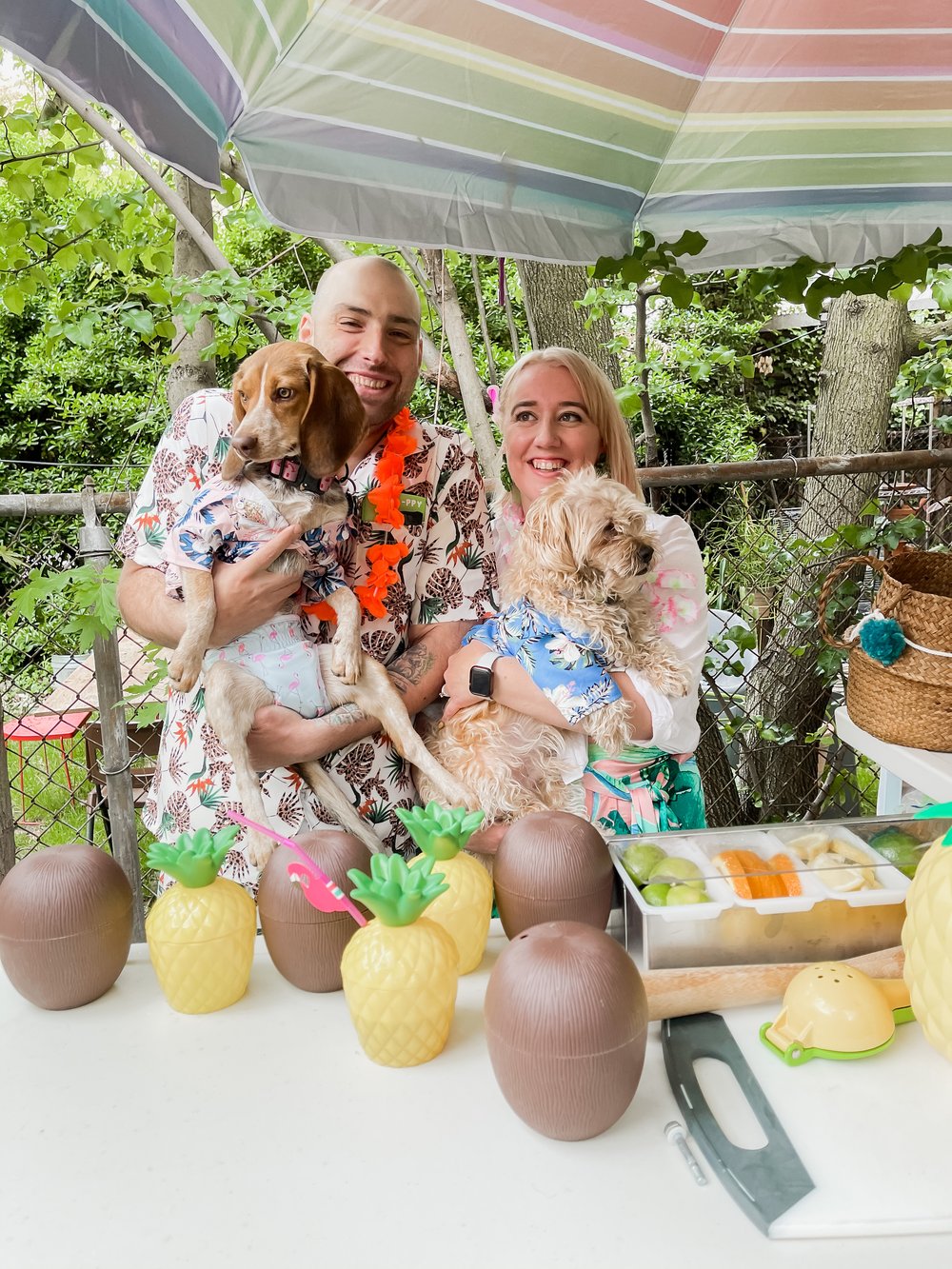 Jennifer and Andy are pictured in Hawaiian shirts whilst holding their two dogs on Jennifer’s 30th birthday in May 2020. Photo: Jennifer Risi