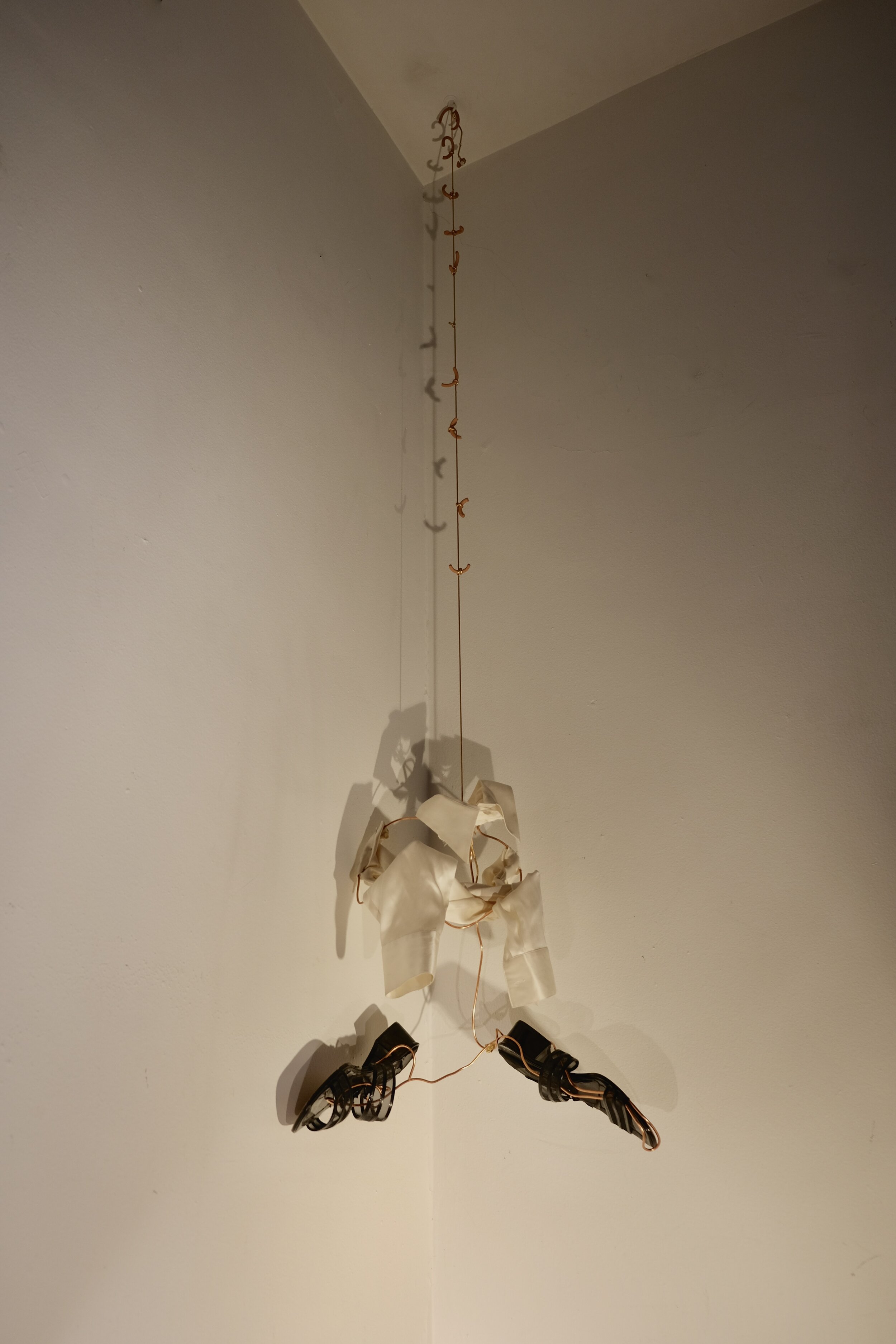   A Lonely While , 2020  ceramic, satin, copper wire, shoes, gold cord 