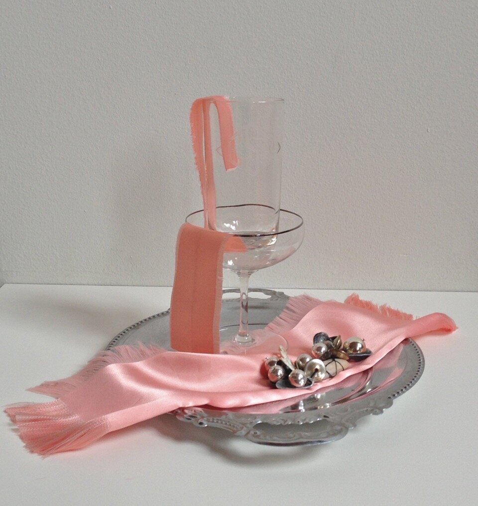  Water Service , 2013  pewter tray, satin, champagne glass, glass tumbler, jewelry parts, shells, thread 