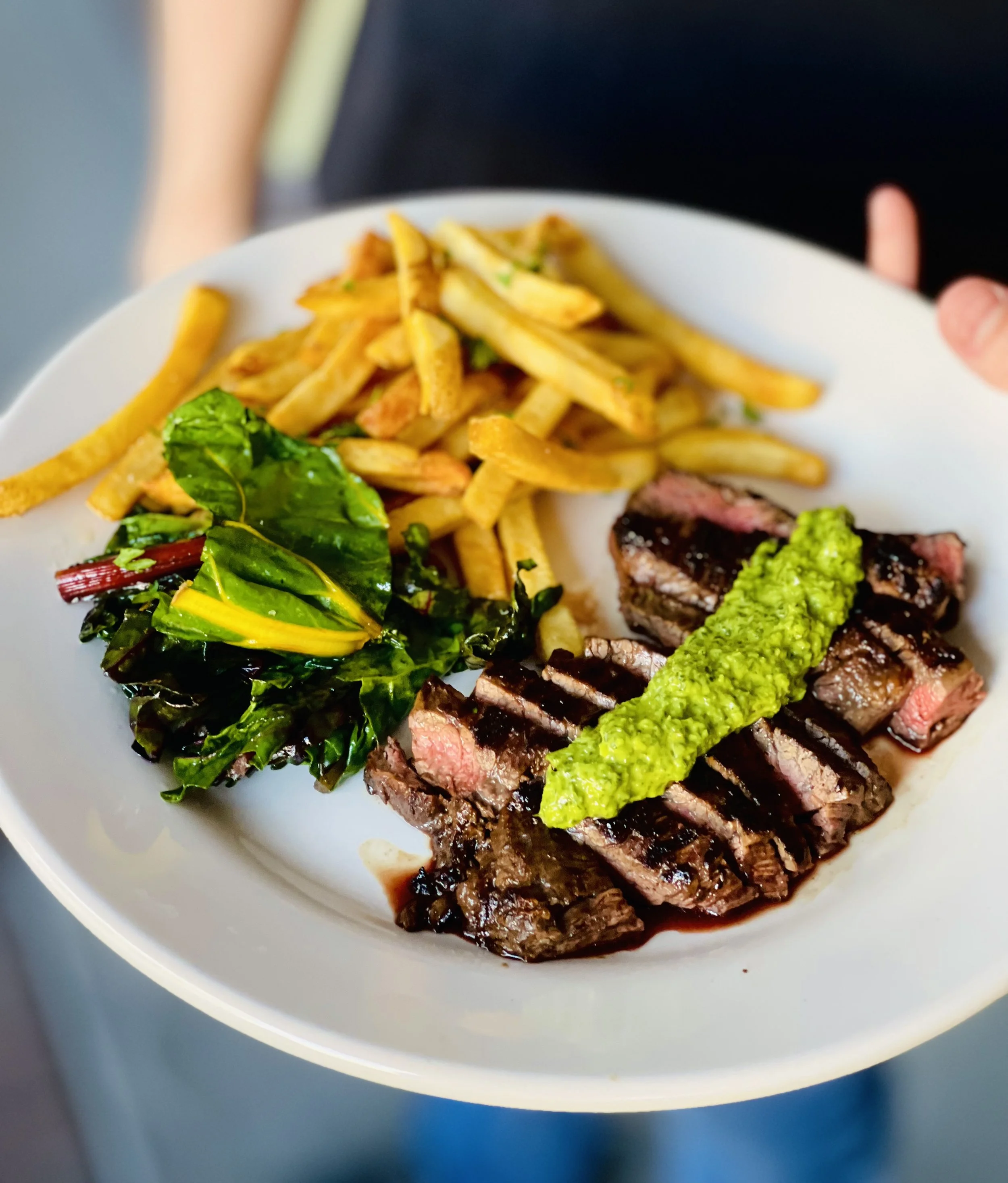 steak_on_plate_with_chimichurri_sauce_fries_spinach.jpeg