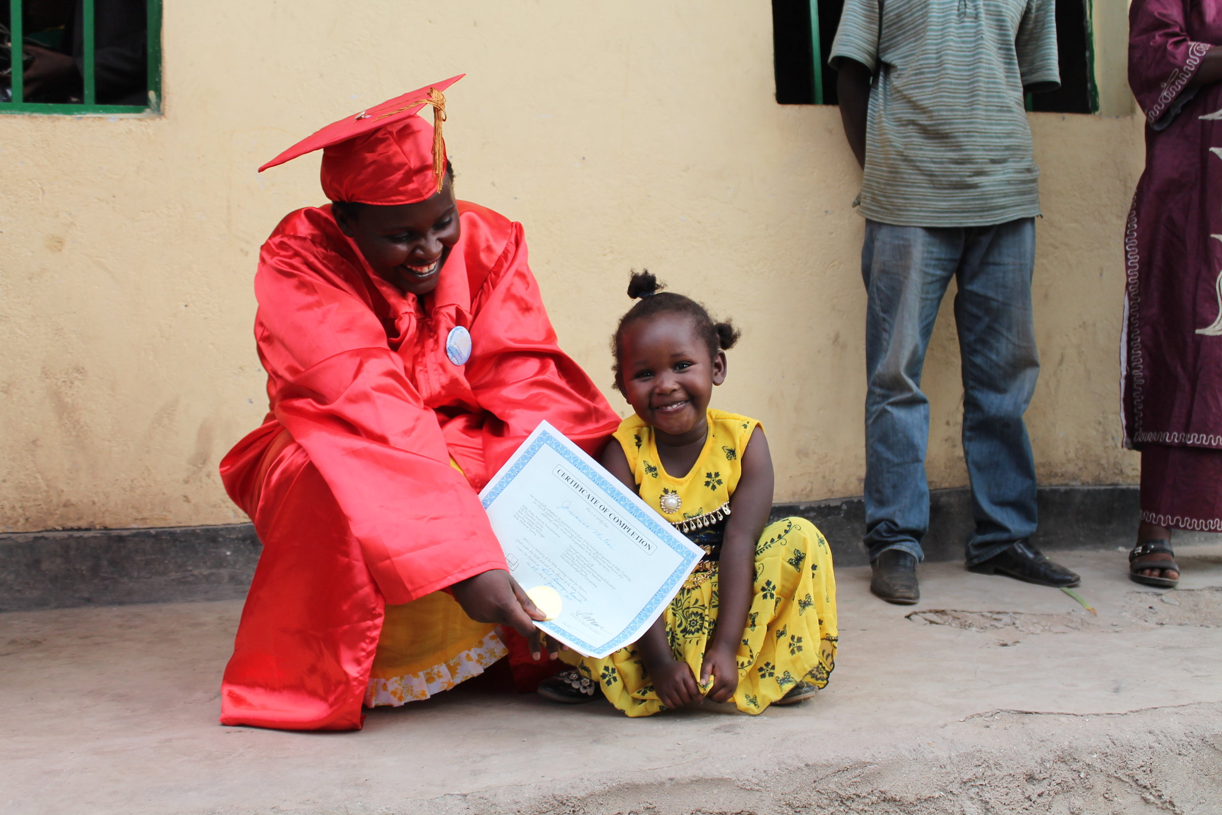 mwanamke-lady-btcl-graduate-and-child-Rwanda-kanisa-kiongozi wa Biblia.jpg