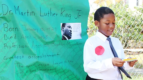A UCP Pine Hills student presenting the biography of Dr.Martin Luther King Jr. as part of his “Living Museum” project.