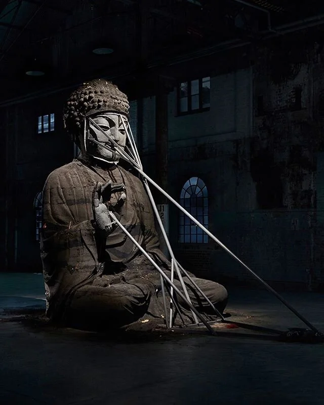 Ash Buddha by Zhang Huan, made from incense ashes (except the hand and face, I believe)