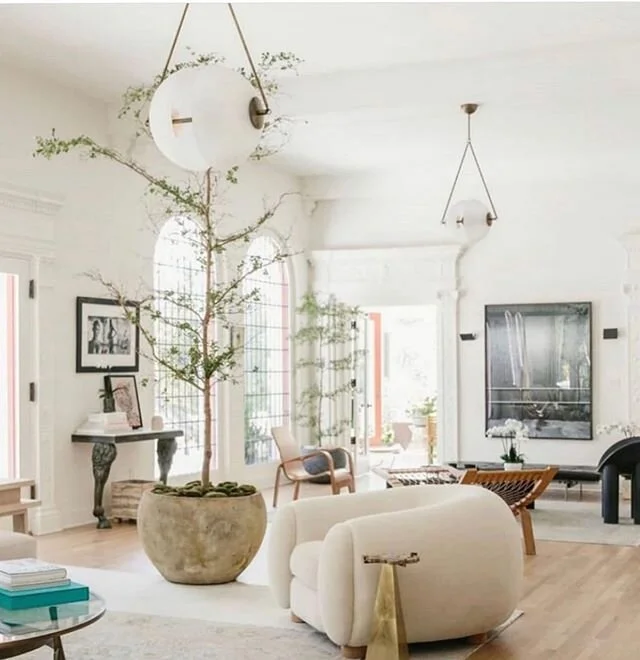 I am all about mixing old and new together creating a eclectic mix of style! This open space has so much beauty in it. Look closely at the different and unique styles of furniture! Not to mention the most incredible lighting!  What a wonderful room t