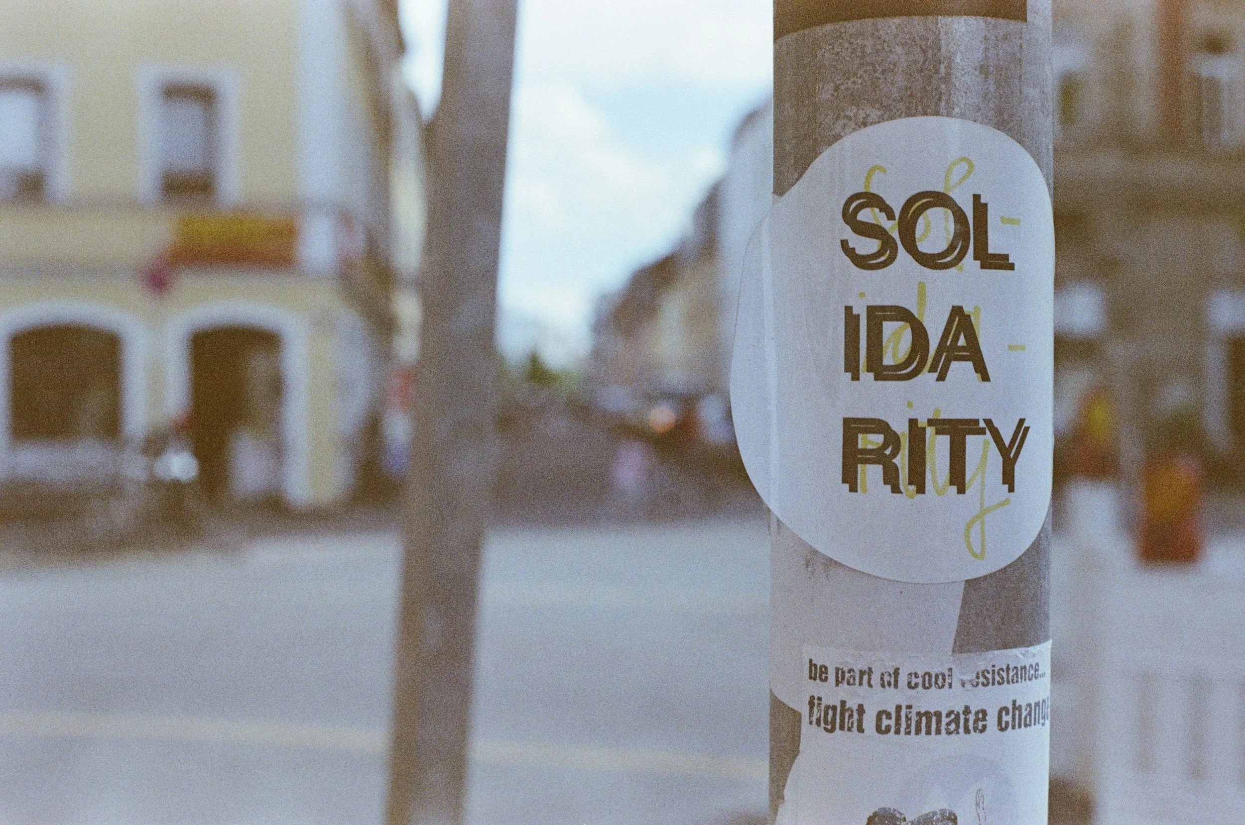 the word solidarity on a street sticker