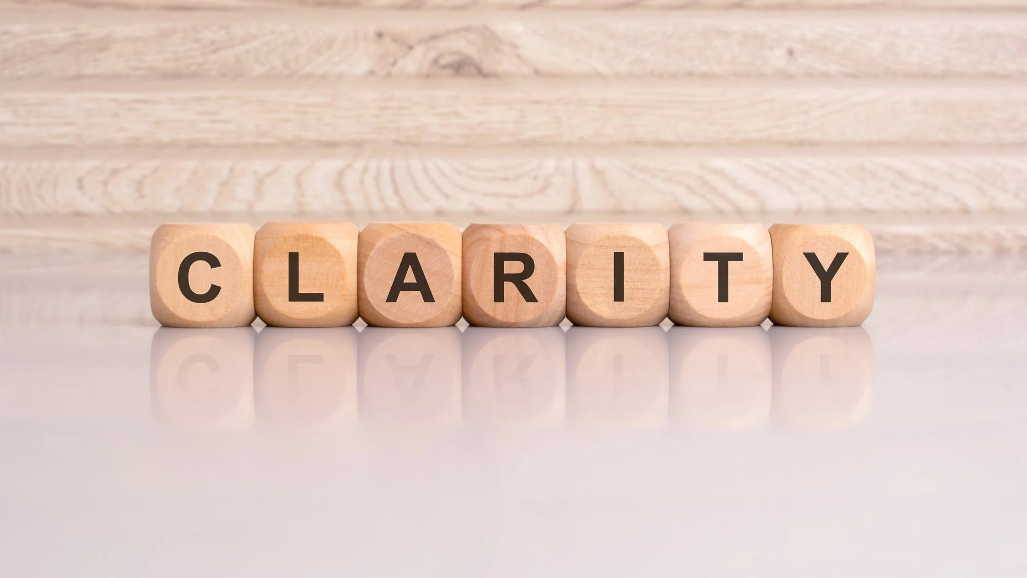 image of dice showing the letters c l a r i t y