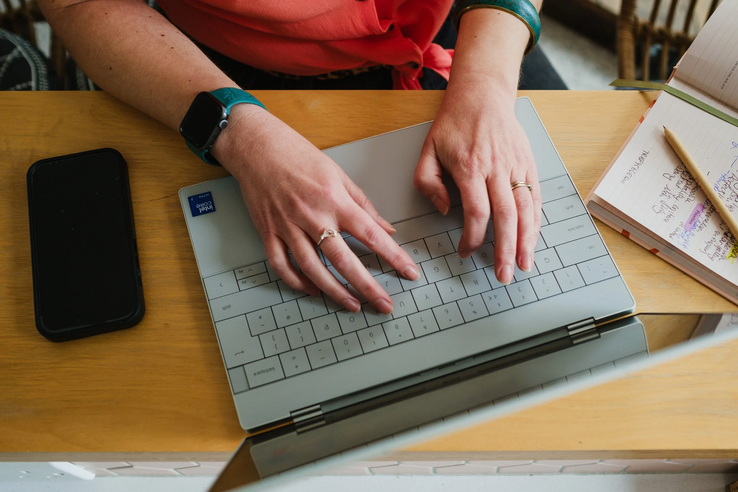 a photo of philippa hammond's hand typing on a laptop