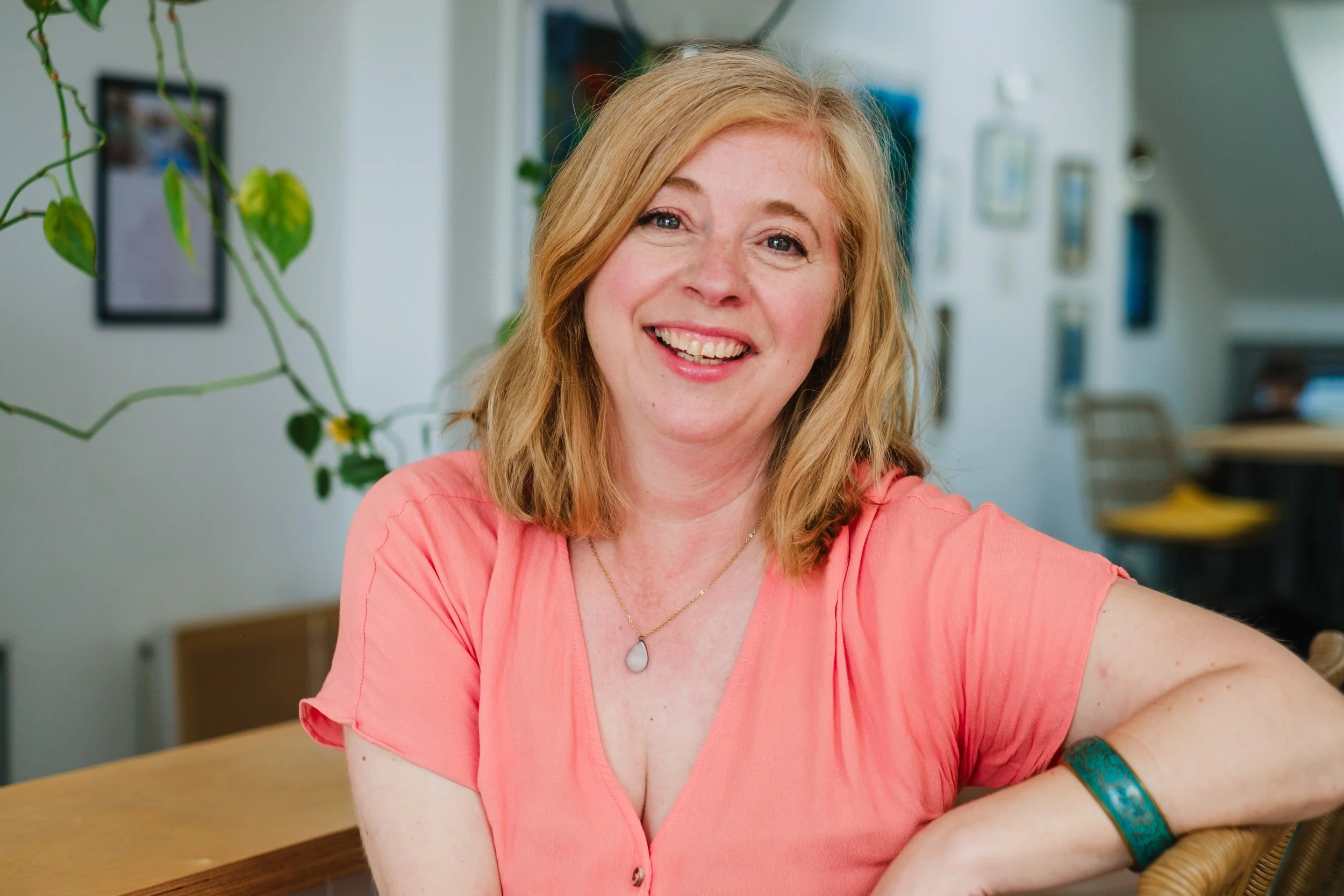 Philippa Hammond laughing wearing a peach coloured top