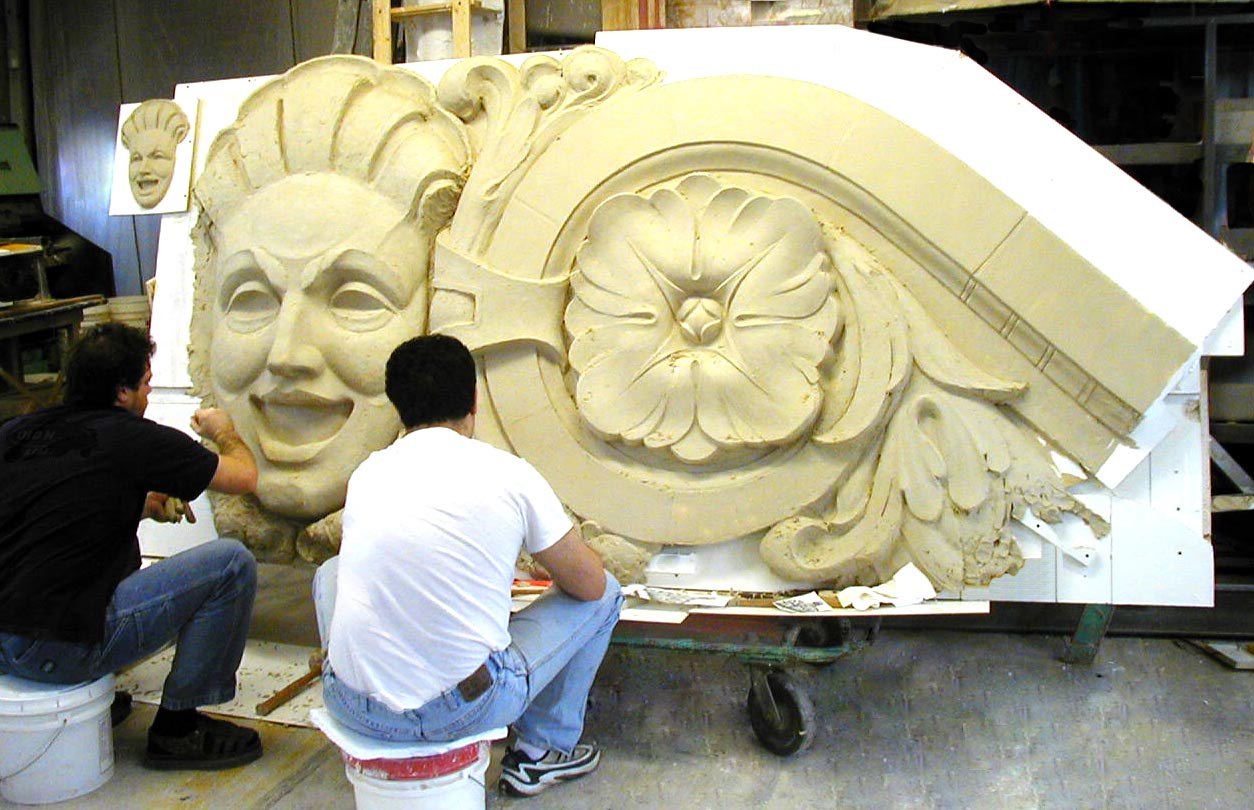  Two Sculptors working on the main building piece for the historical restoration of Sheas Theatre in downtown Buffalo, NY 