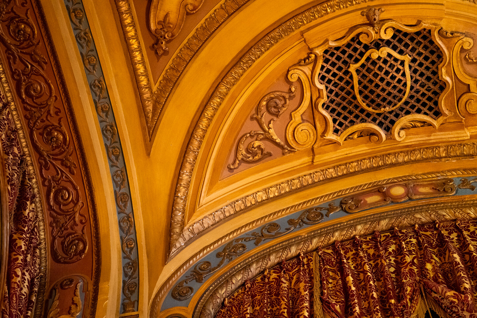  Cast plaster ceiling decorated in gold with blue accents 