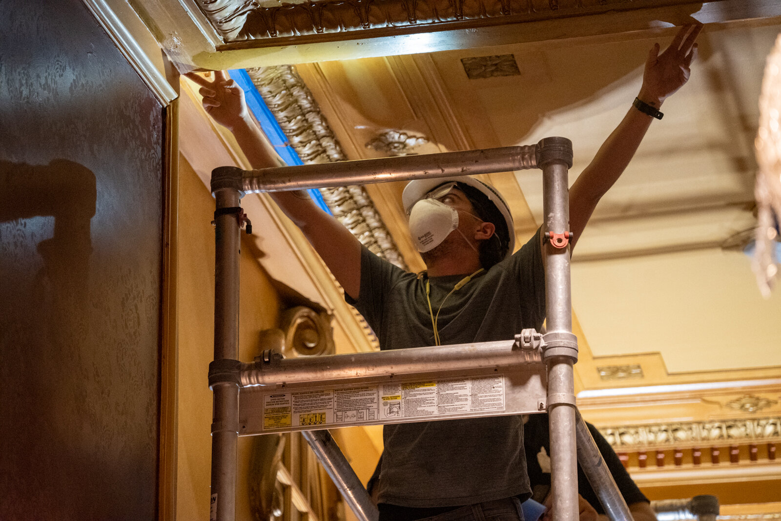  A worker taking a measurement of the ceiling in Sheas theatre, located in downtown Buffalo, NY 