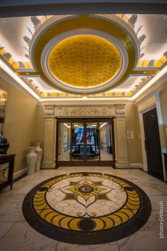  Interior picture of curtiss lobby. A large ornate dome is in the center of the ceiling.  