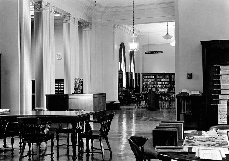 Historic library interior with columns and bookshelves