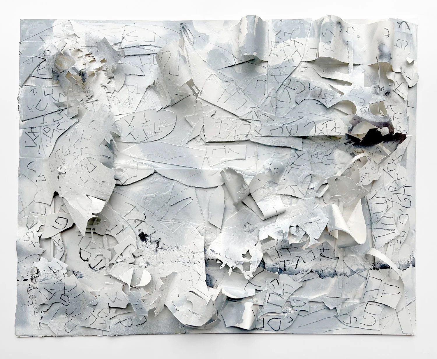 Mixed media art piece with white paper and black ink, crumpled and torn in abstract arrangement, with scribbled writing and sketches.