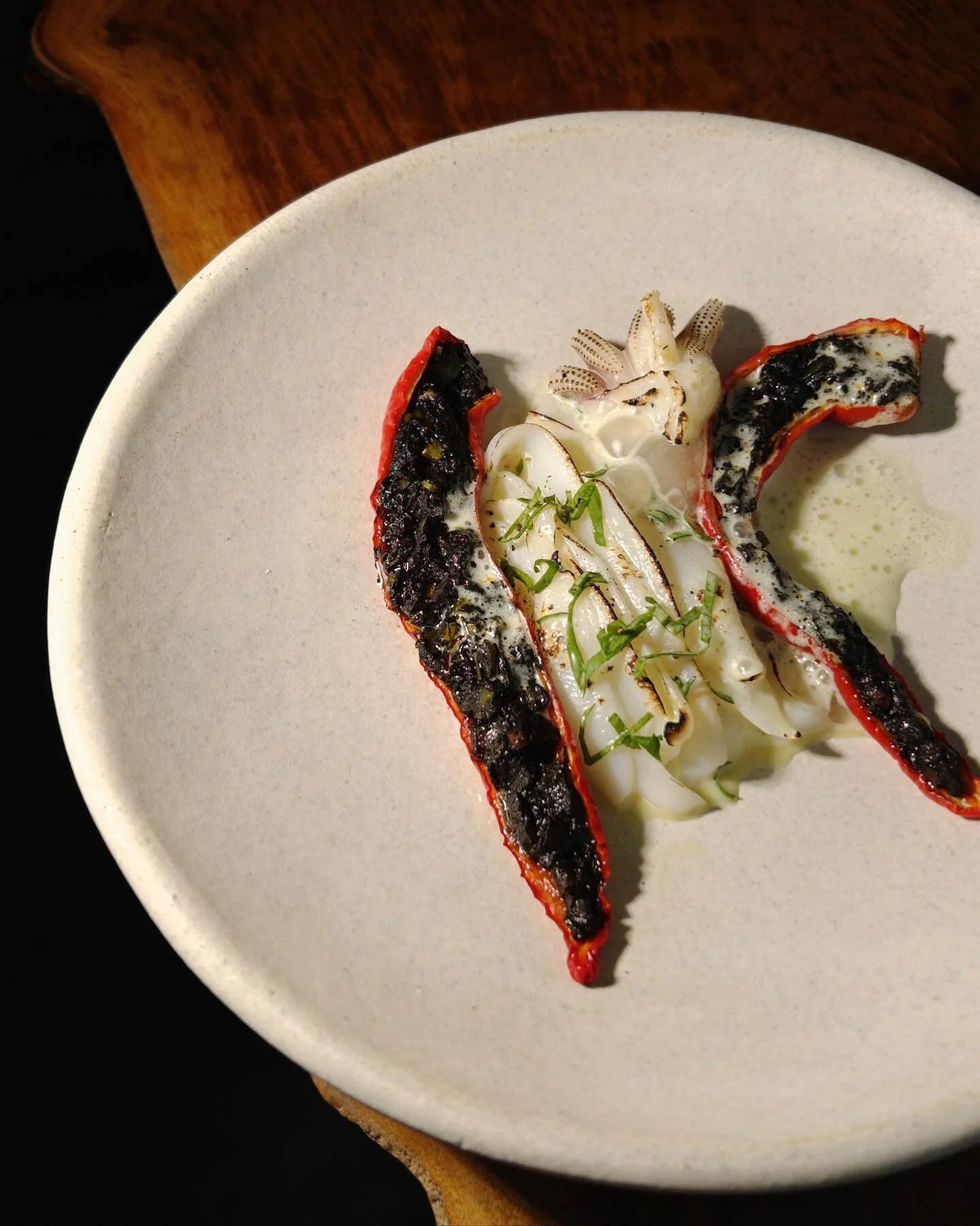 Grilled sepia with jimmy nardello peppers stuffed with sofrito.