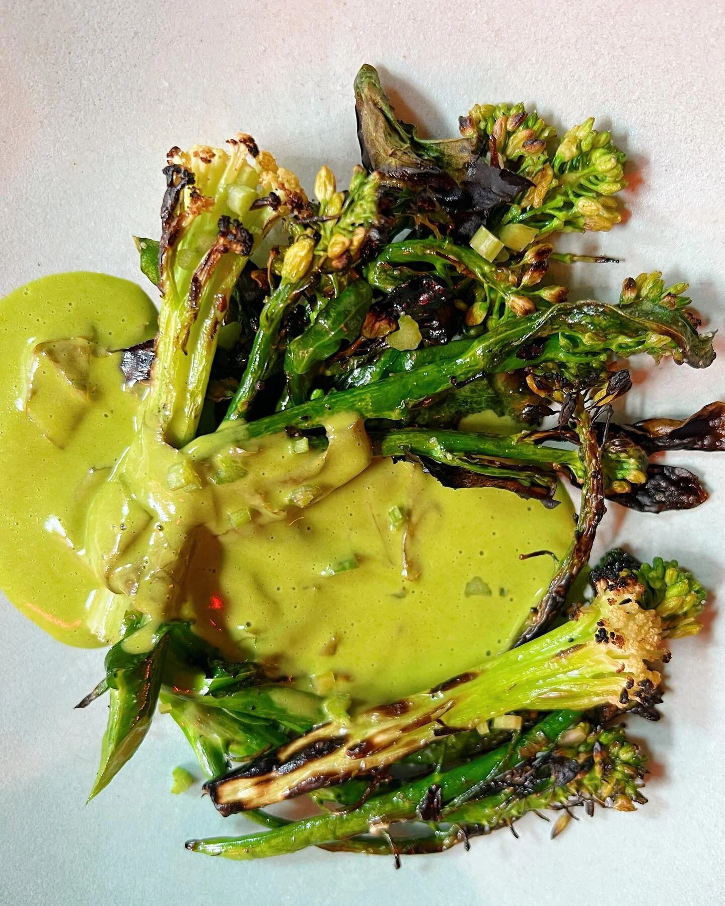 Grilled broccolini, sorrel and our vegan tarragon vin jaune sauce by @mikejchau