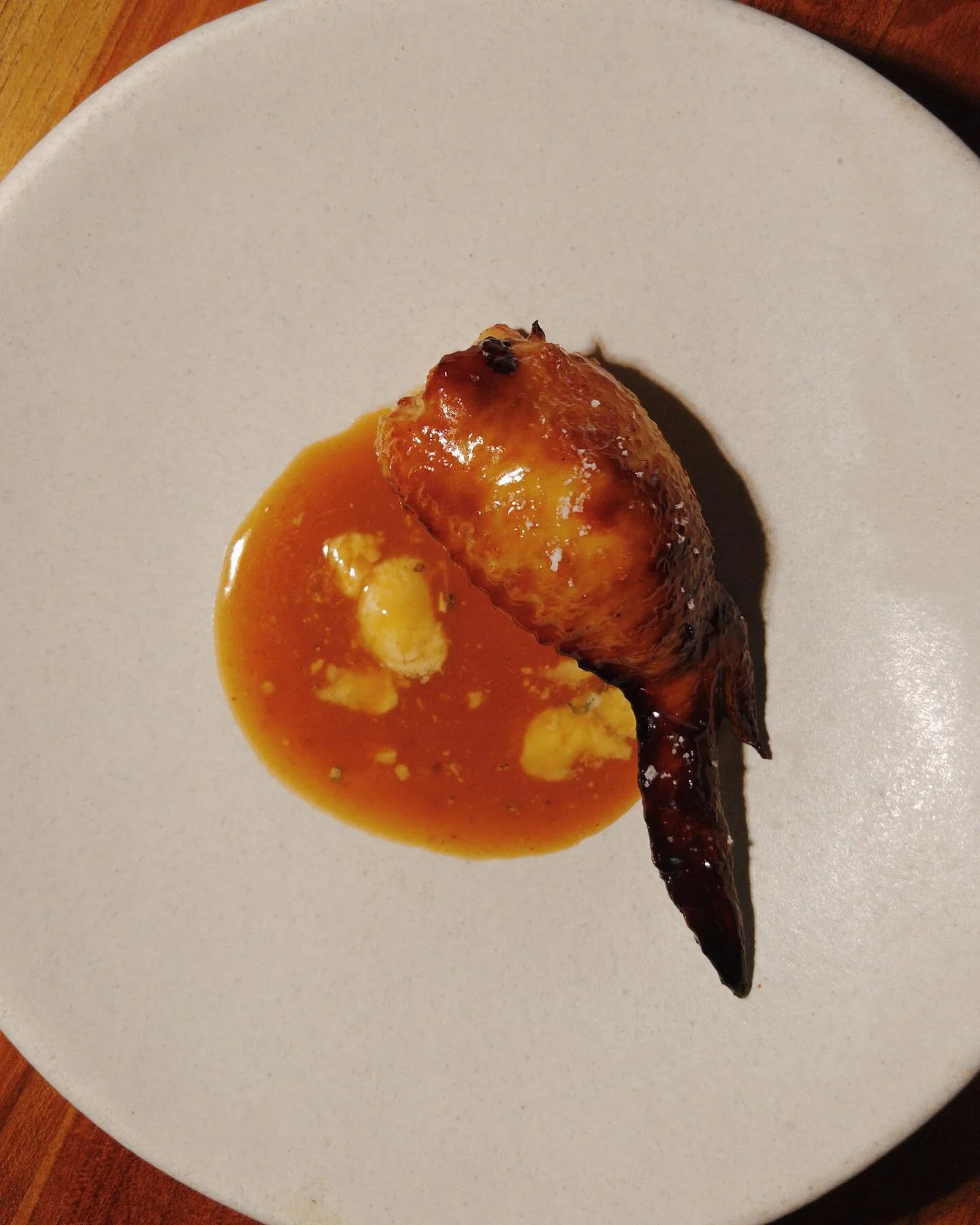 Grilled chicken wing stuffed with a pork &amp; watercress sausage served with a chicken sauce infused with Stilton cheese.