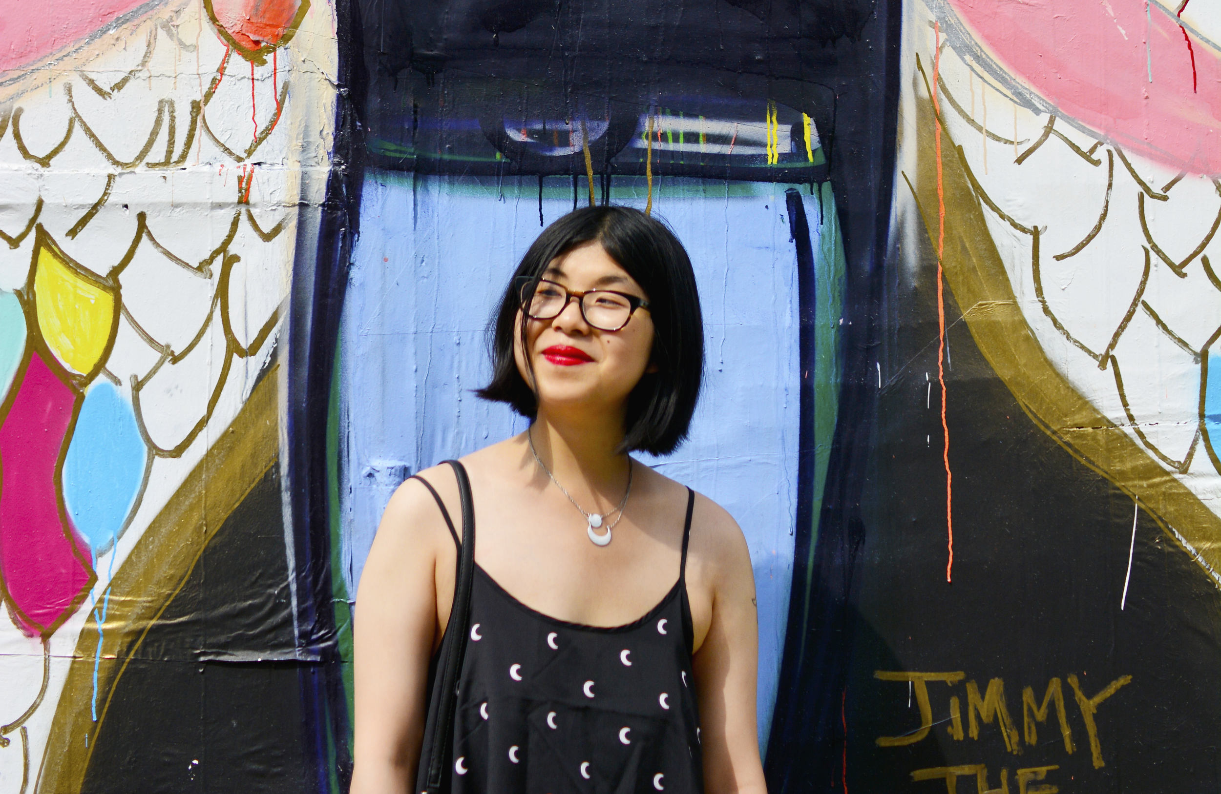 Discovering graffiti at the Welling Mural Court Project in Queens, NYC with a moon print dress, Sol Sana cut-out ankle boots, and ZARA crossbody bag with patches.
