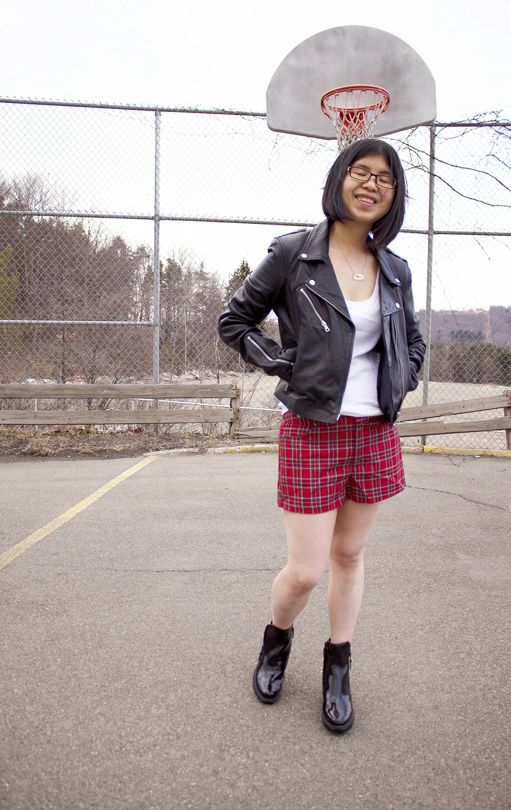 Simple but casual edgy fall outfit featuring tartan shorts, ZARA leather jacket, and Opening Ceremony boots