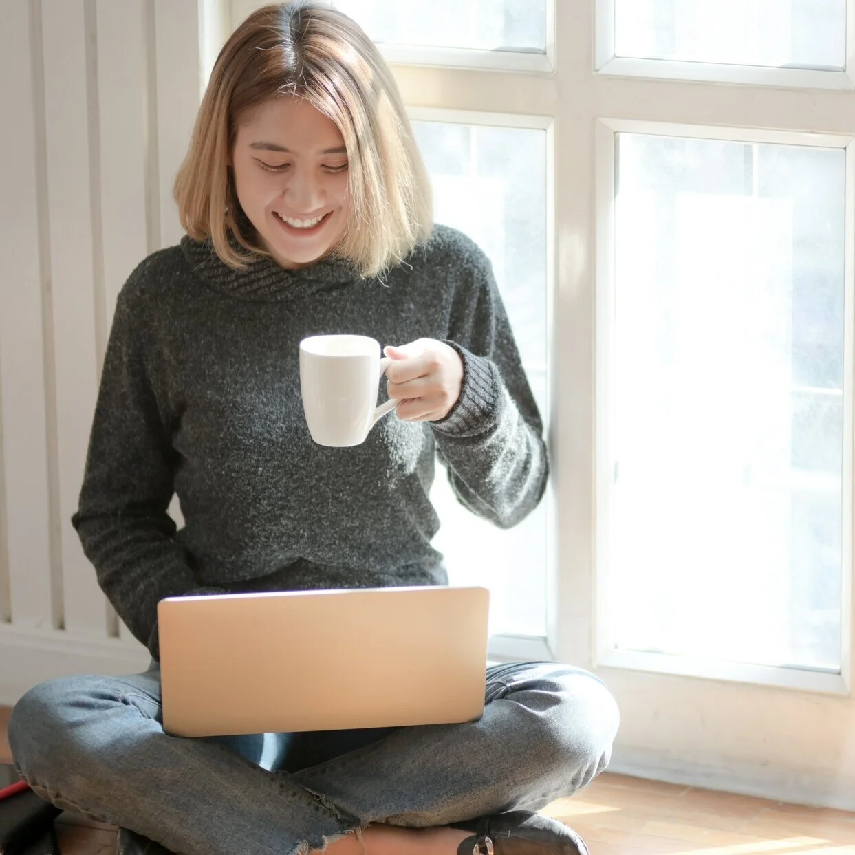 woman-in-gray-sweater-drinking-coffee-3759089.jpg