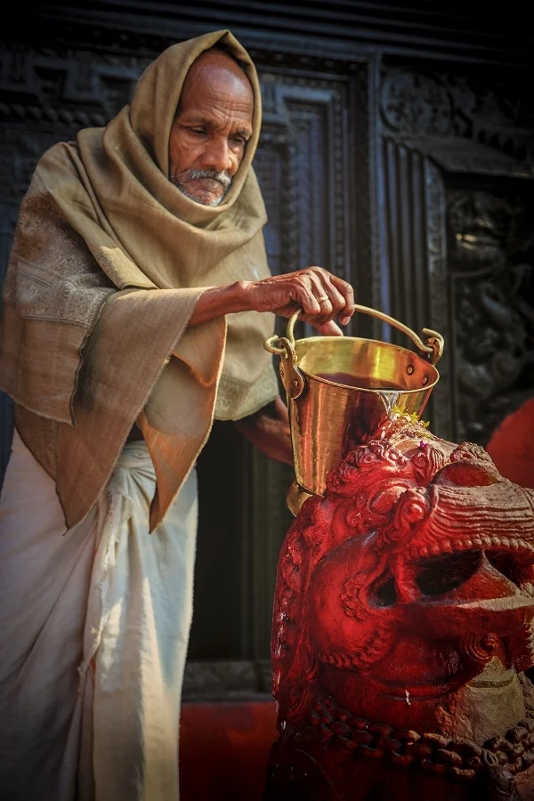 Temple Priest Watering