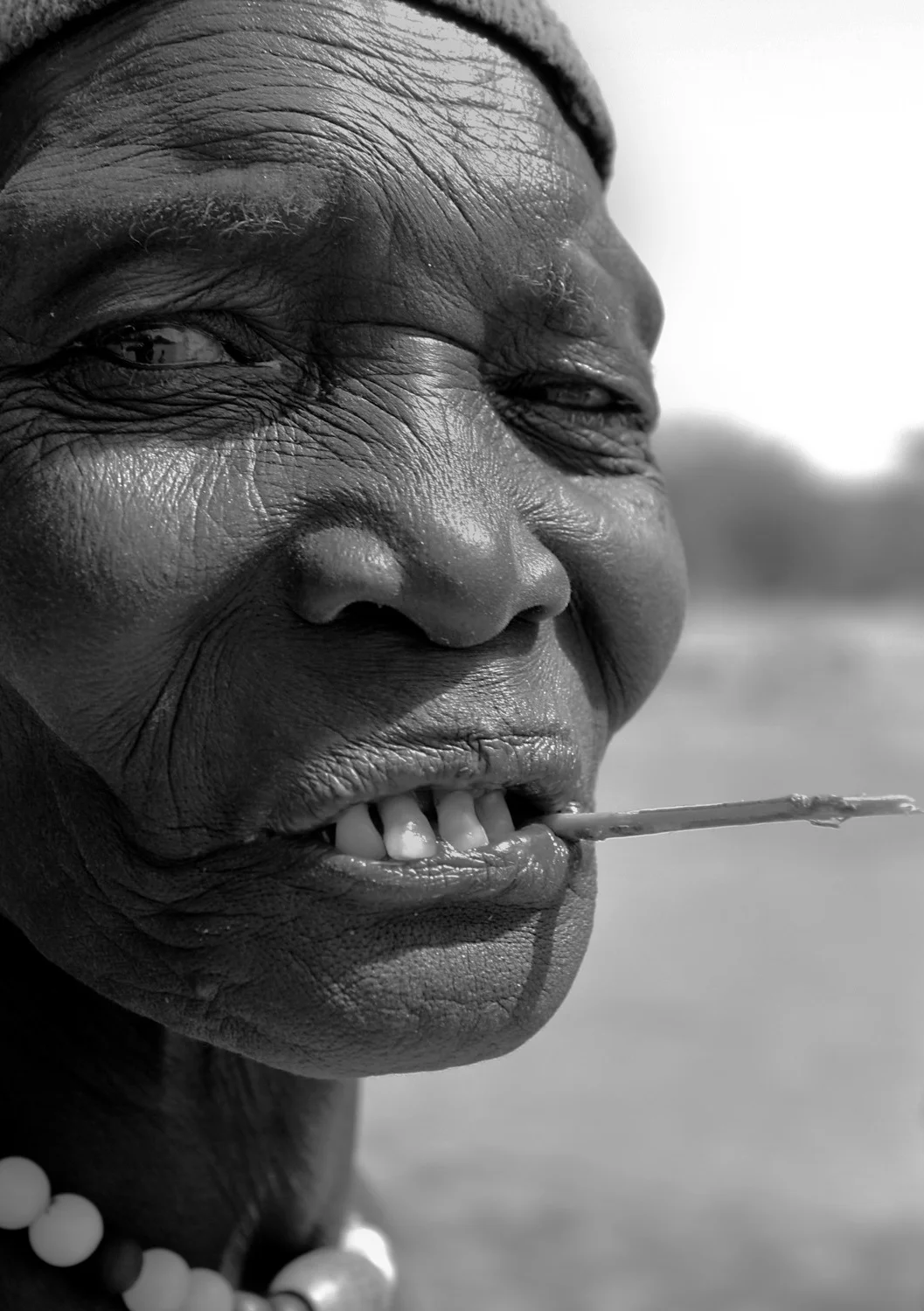 Wise Lady with Large Toothpick