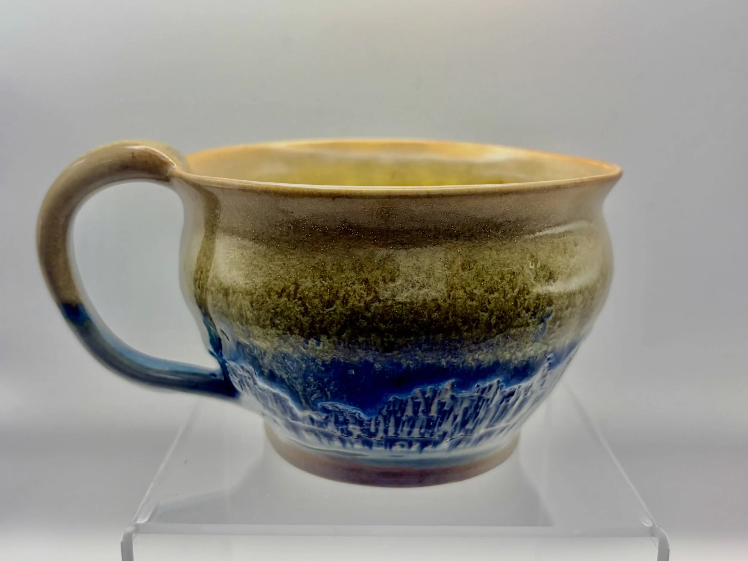 A new mug and glaze combo using yellow salt, floating green and cobalt carb. Stoked about the results! #mug #ceramics #glaze #cone10 #clay