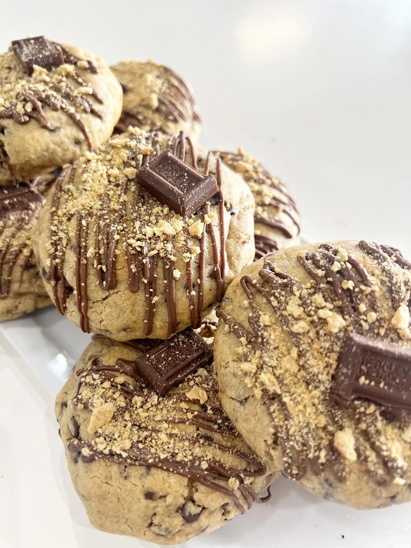 Stuffed S&rsquo;mores Cookies &mdash; everything you love about a campfire, baked into a cookie.🔥🍫✨ 
#StuffedSmoresCookie #SmoresLovers #BakeryTreats #JustDeliciousBakery #CookieCravings #DessertTime