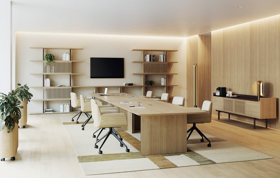 Modern conference room with a large wooden table, white chairs, wall-mounted TV, built-in shelves, potted plants, and a side cabinet with refreshments.