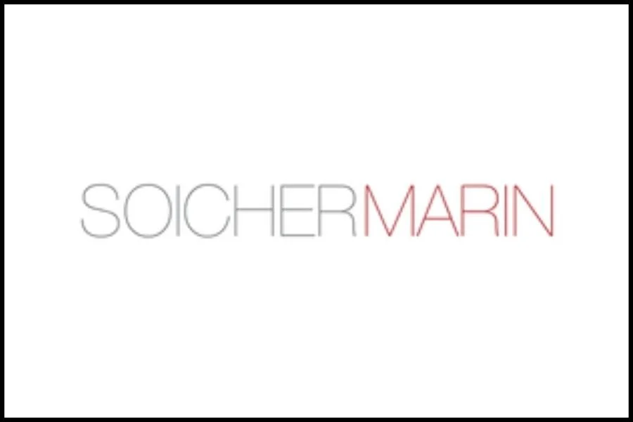 Logo with the words 'SOICHE R MARIN' in thin, stylish font, with 'MARIN' in reddish color and the rest in grey, on a white background.