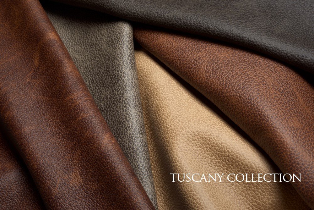 Close-up of various textured leather fabric swatches in brown, gray, and beige, labeled Tuscany Collection.