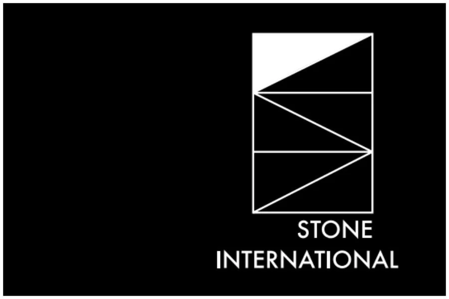 Black background with a white geometric logo consisting of a rectangle with diagonal lines and the text 'STONE INTERNATIONAL' underneath.