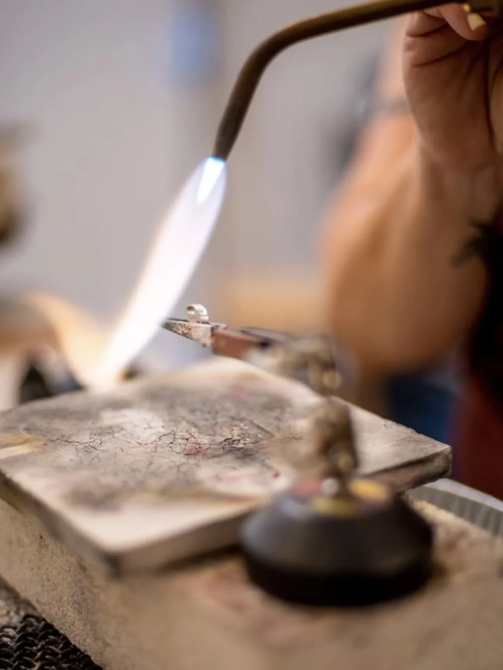 Sylvie Alusitz soldering a silver ring