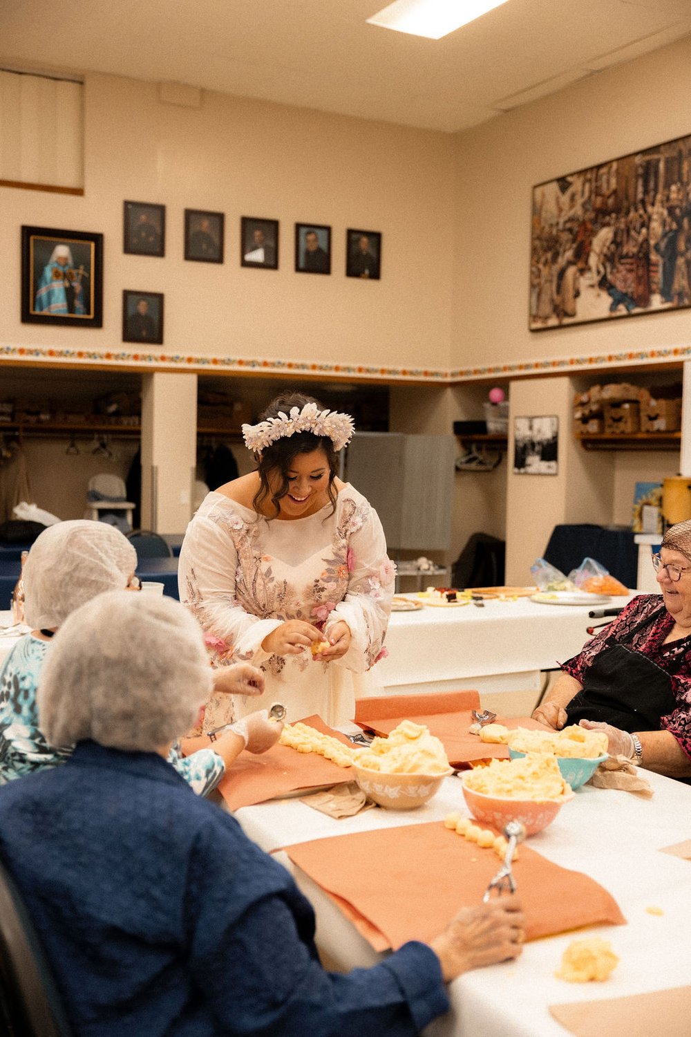 Hannah Picklyk pinches a perogy before her wedding ceremony 