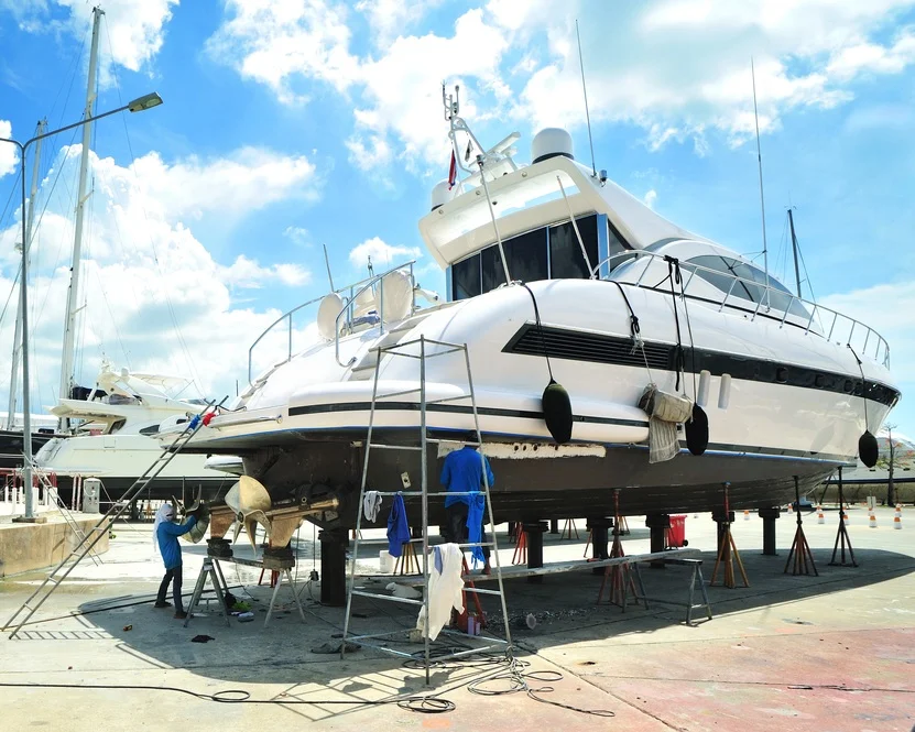 Luxury motor yacht in dry dock for repair. Artisan marine contractor insurance.