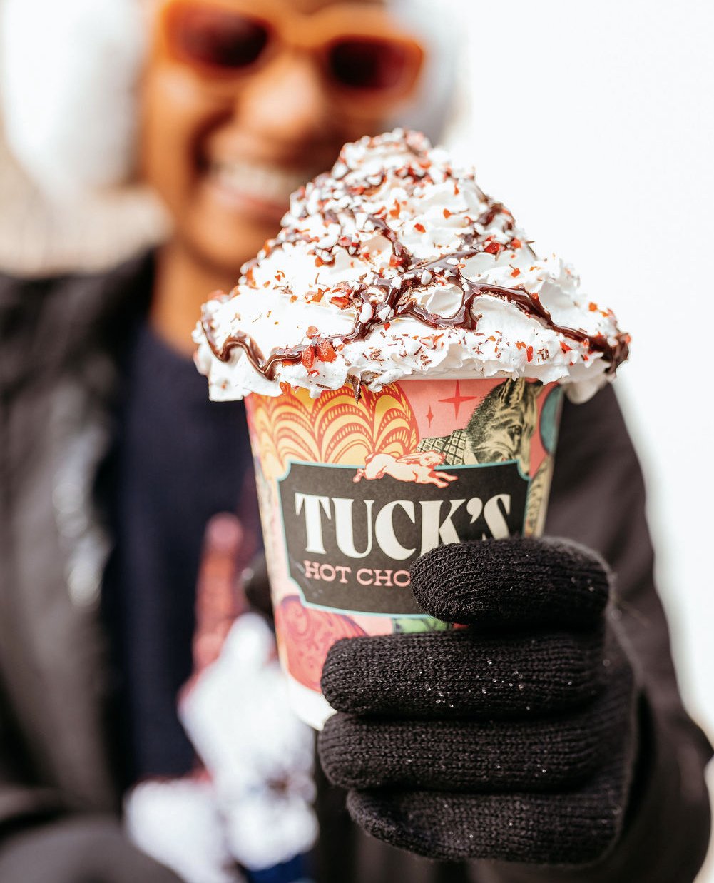 Pictured: the only way we've survived the cold temps this year.⁠
⁠
The gourmet hot cocoa from @tuckstruffles is THE sugar rush of the winter season with the over-the-top toppings and the truffle at the bottom of each cup. Swing by the ice rink and tr