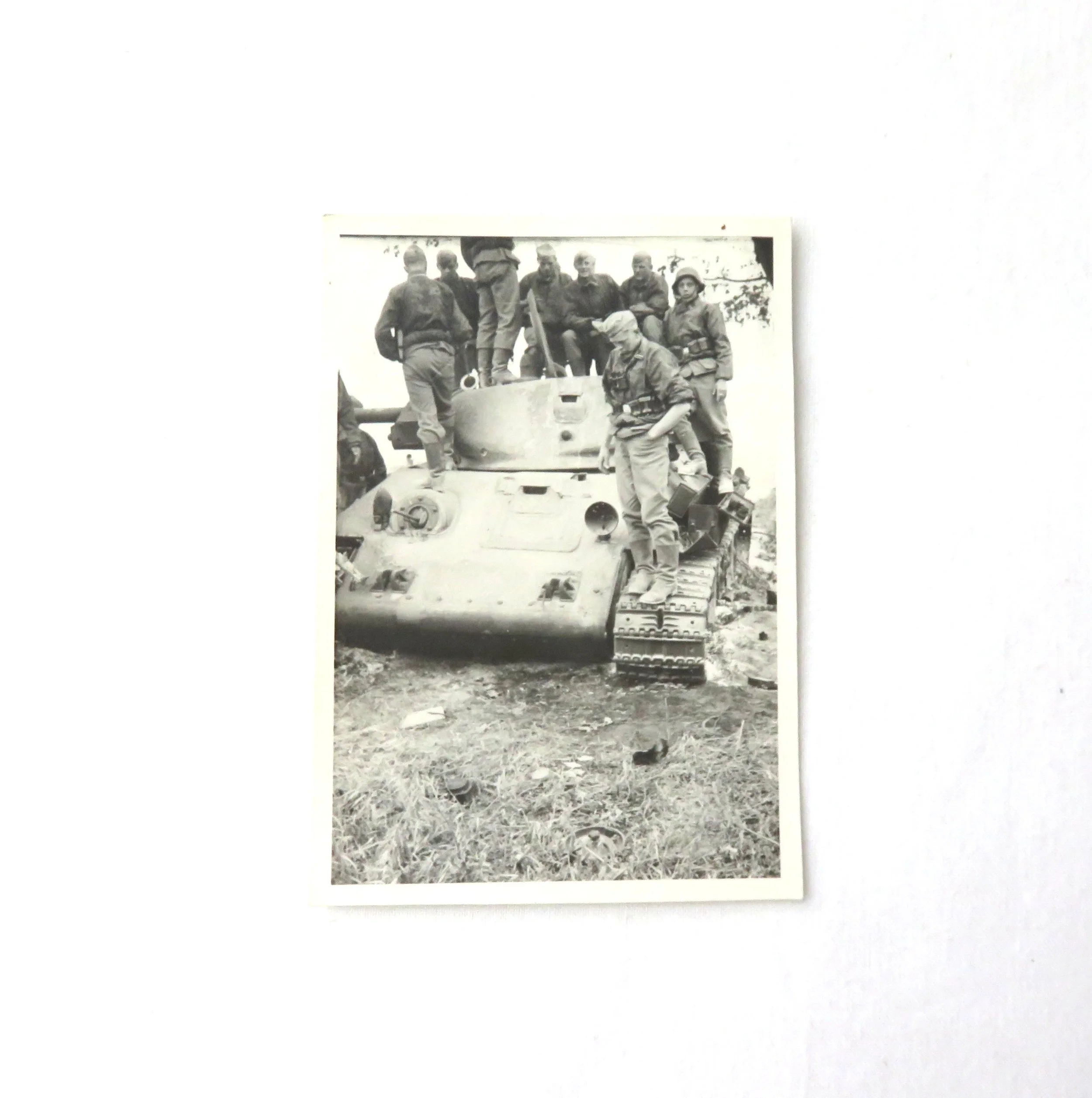 Germany.  Waffen-SS standing on a Russian Tank Photo