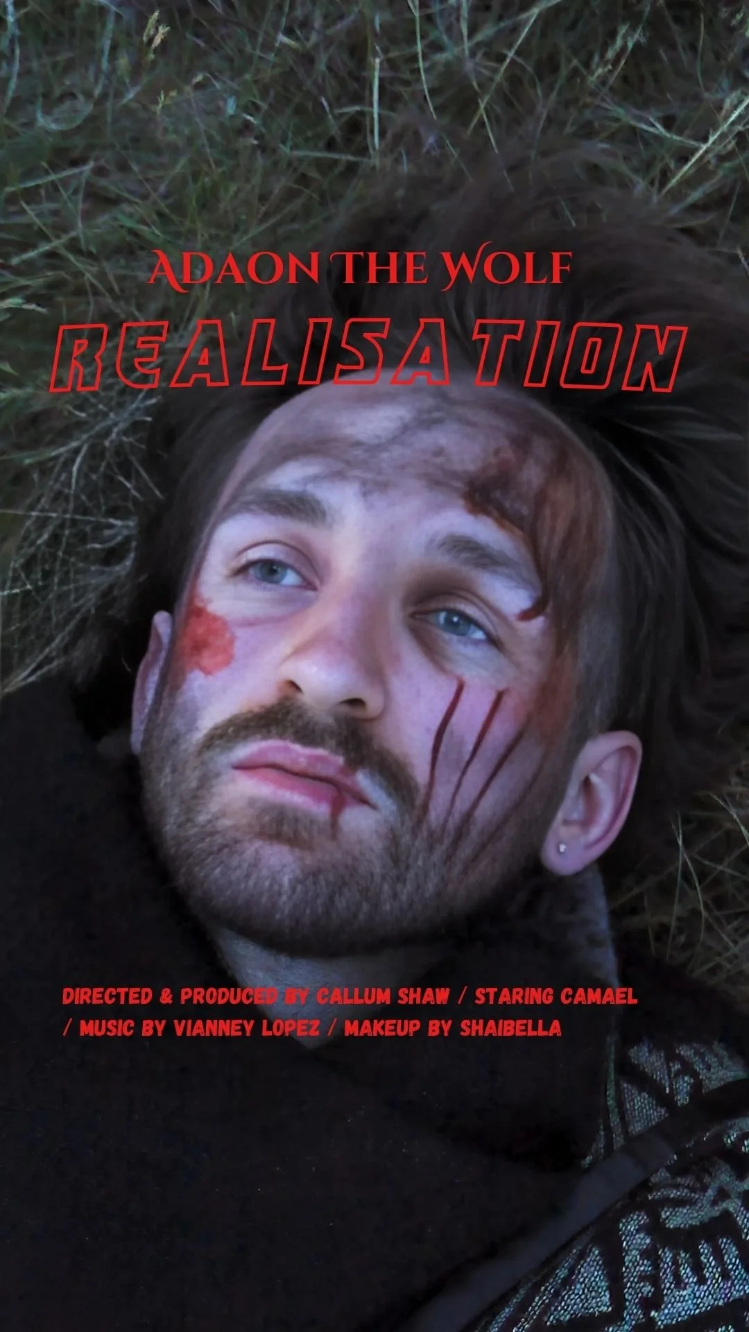 A man with face wounds lying on the ground surrounded by grass, with the title 'ADON THE WOLF: REALISATION' and credits at the bottom for Callum Shaw, Cameron, Vianney Lopez, and Shaibella.