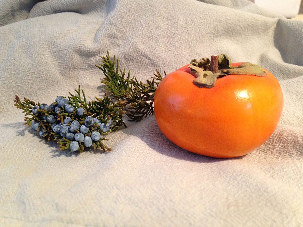 To celebrate the seasons of both coasts, I’ve chosen a persimmon and a sprig of juniper.