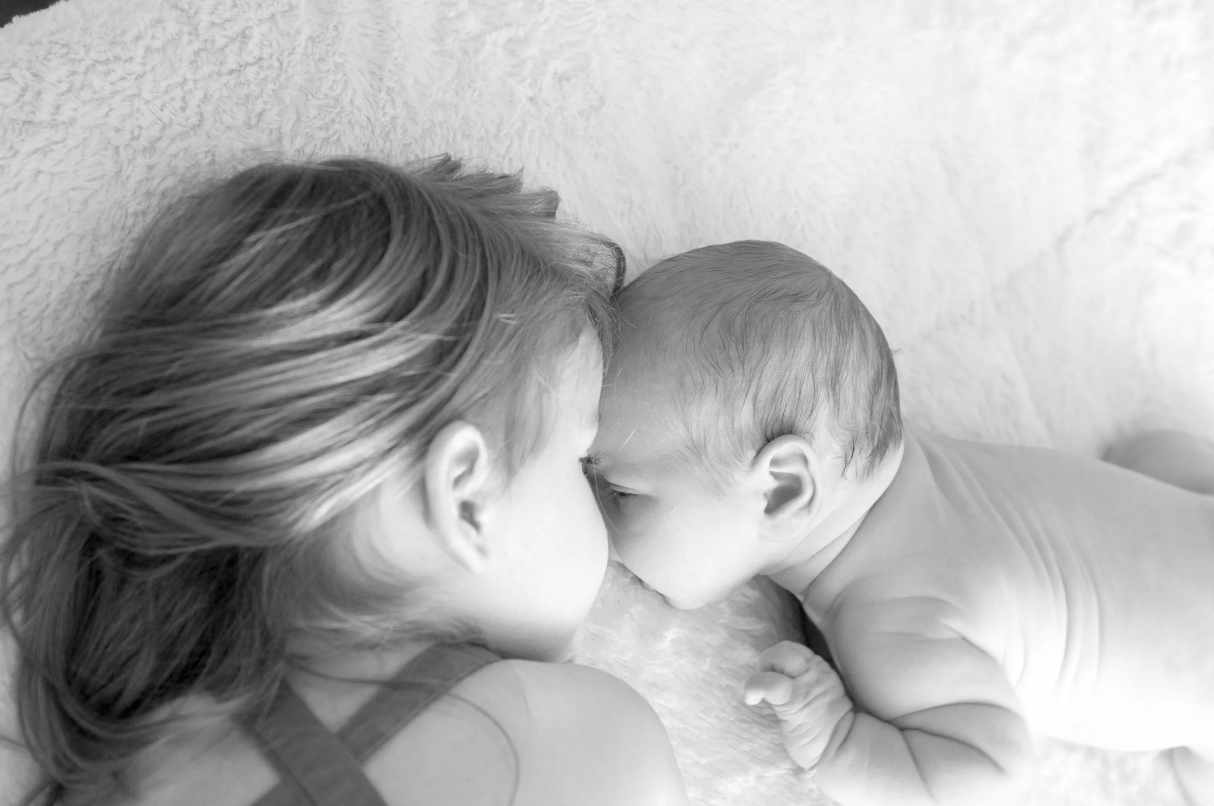 Siblings connecting and snuggling as they learn how to live in a new way
