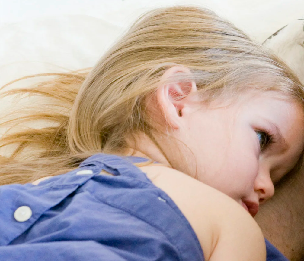 A child calming their body and connecting after a meltdown