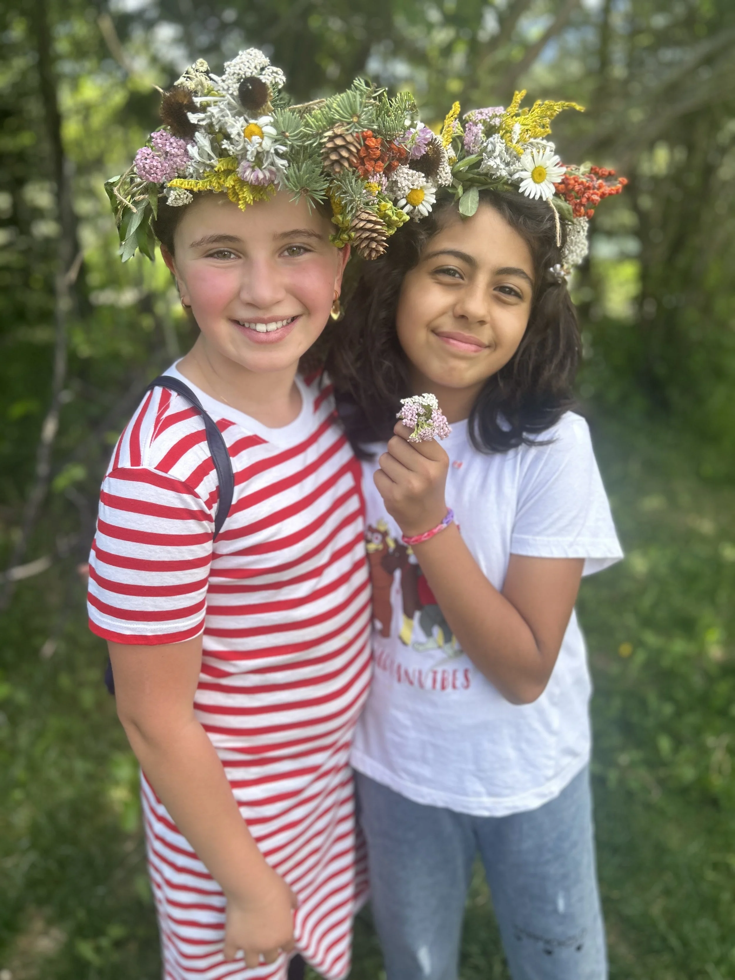 Two Girls In Flower Crowns In Forest.jpeg
