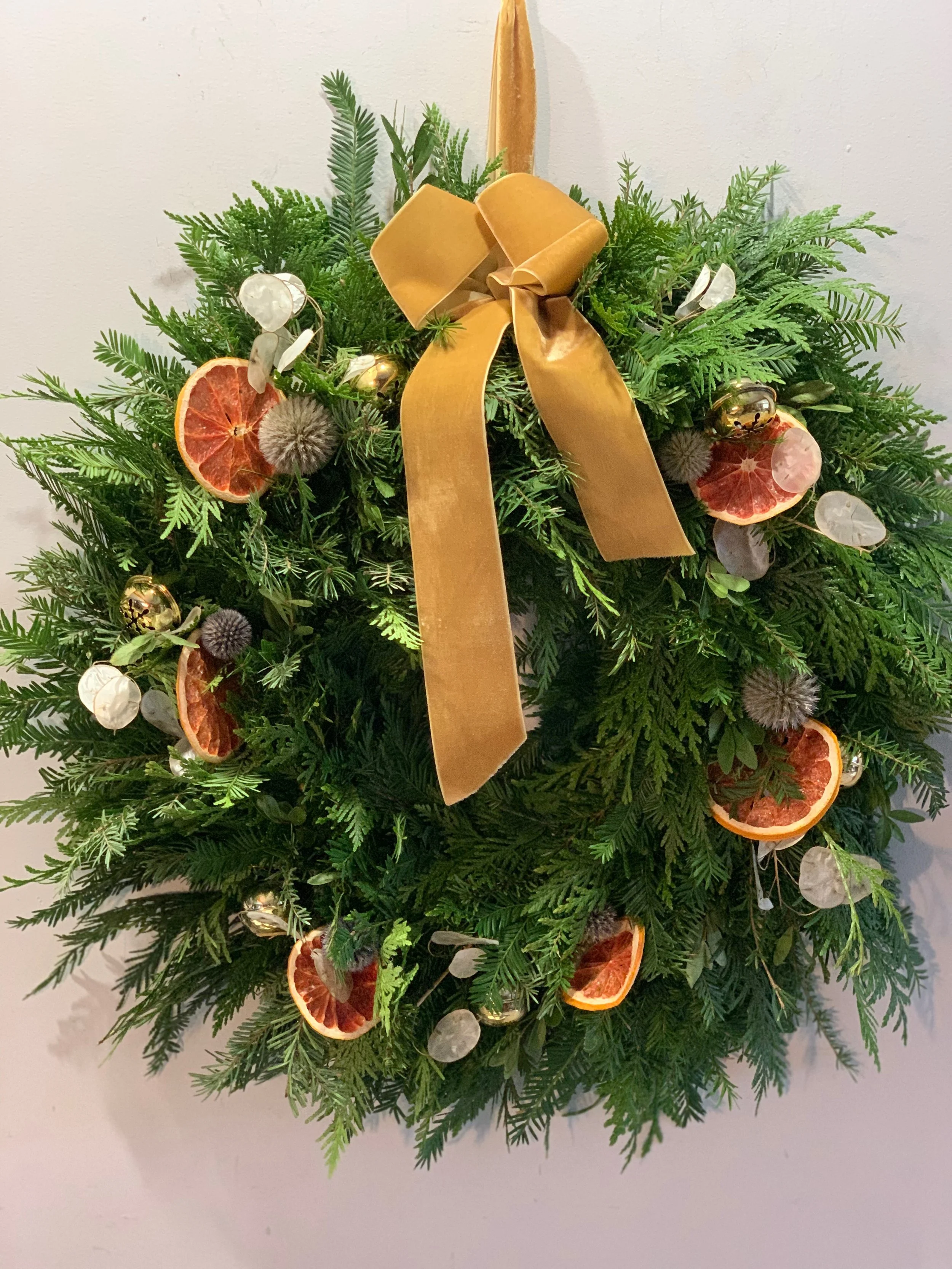 Christmas Wreath with Dried Oranges and Gold Ribbon.jpeg