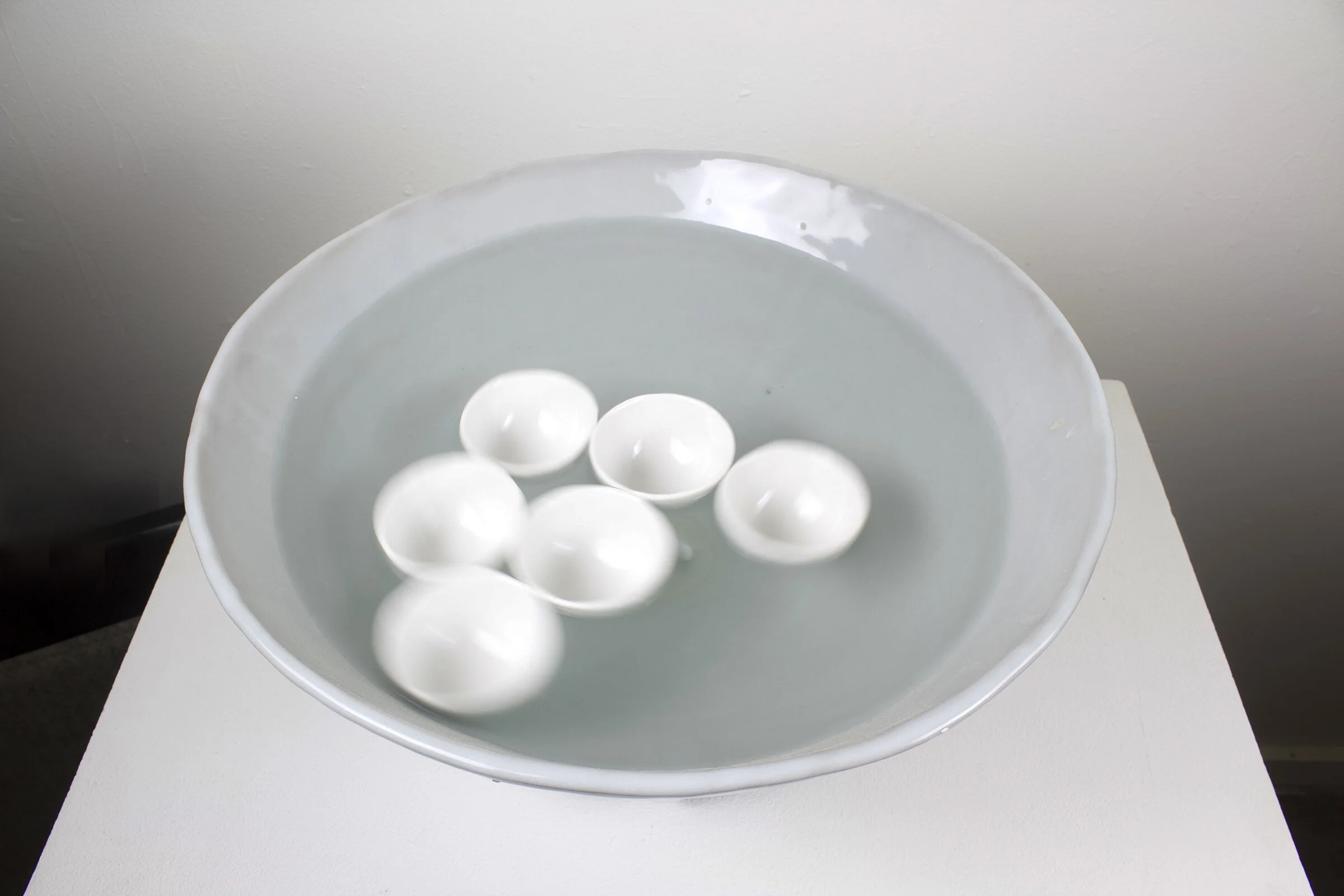   Holding sound,  2021, Porcelain, water, electrical component 
