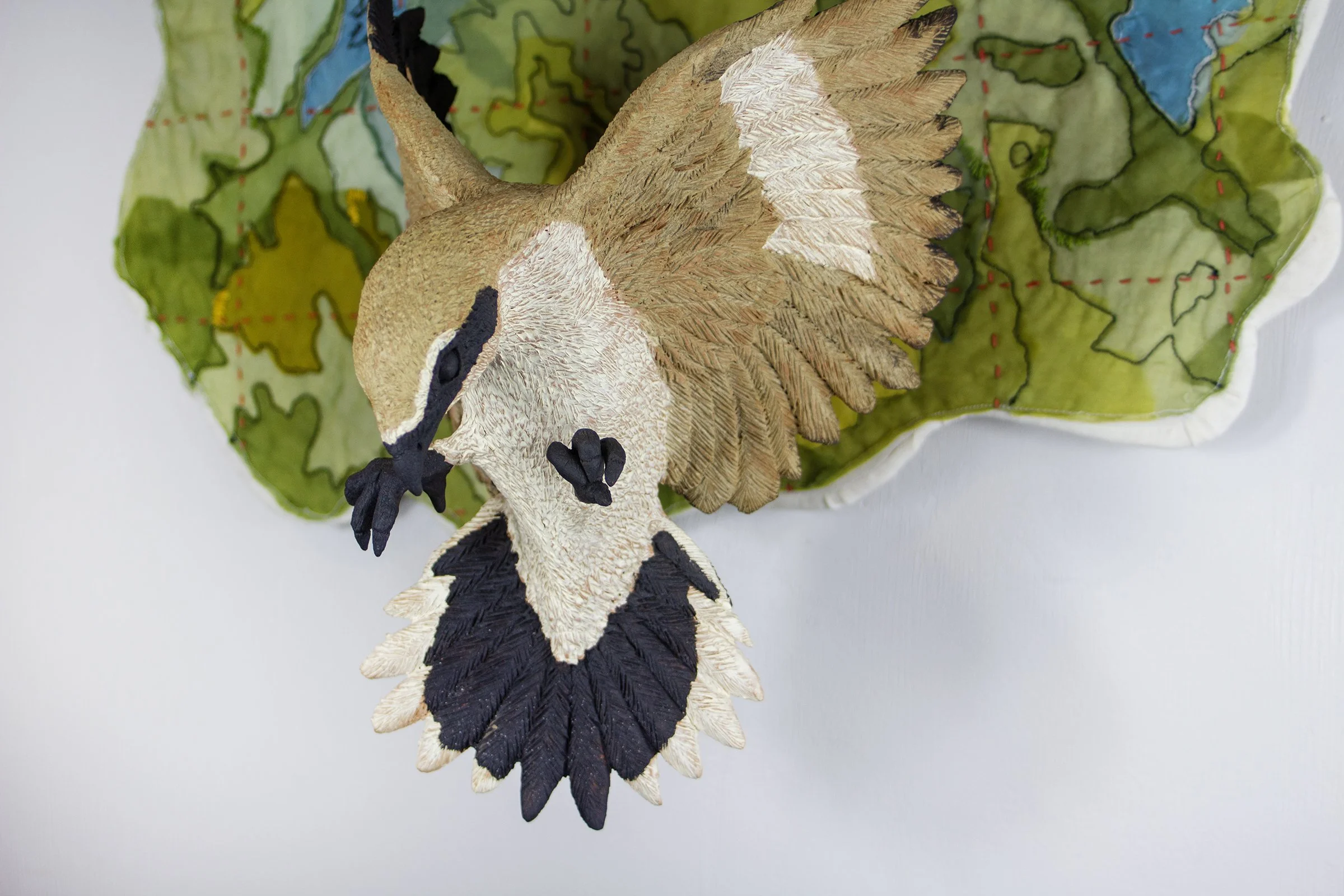 In flight: Loggerhead Shrike 
2025
19 H x 20 W x 10 D
Locally sourced Missouri clay, terra sigillata, hand dyed silk, cotton, embroidery floss

